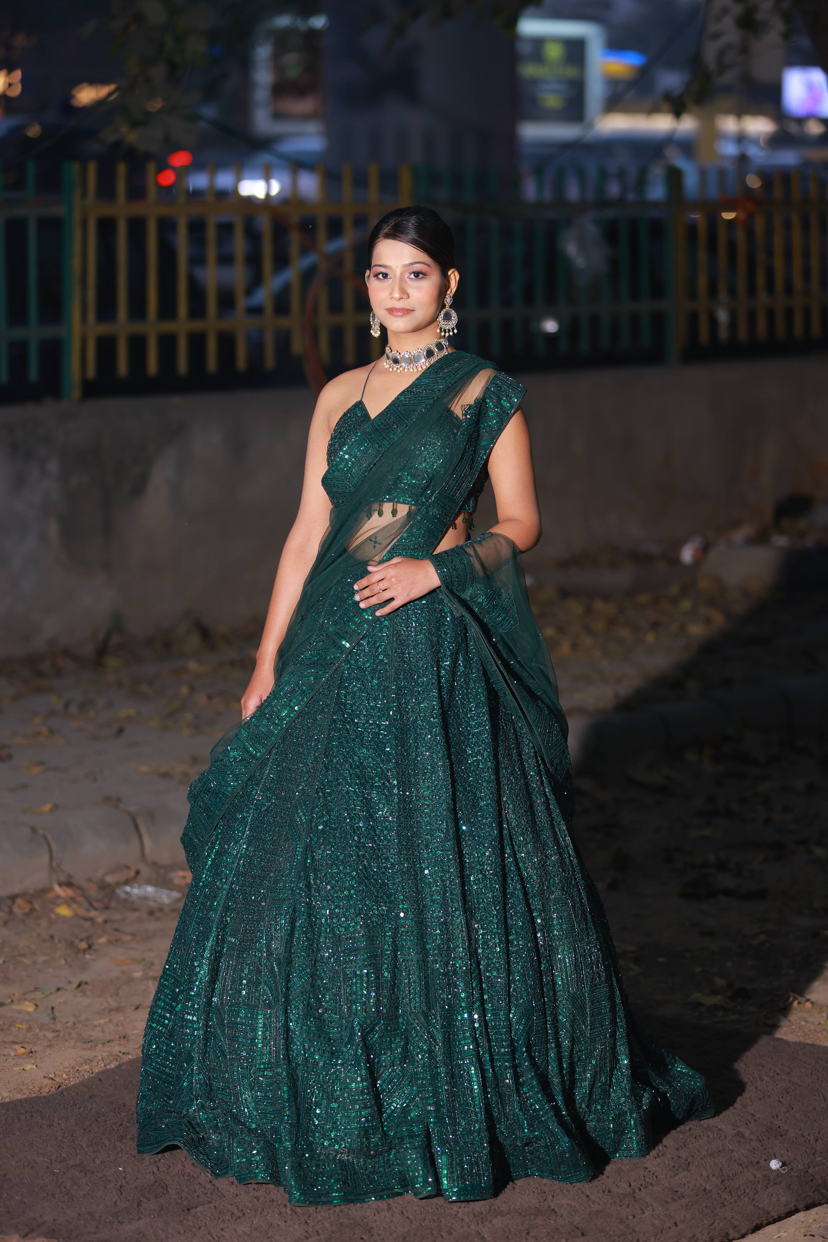 Glamorous Emerald Green Sequin Lehenga with One-Shoulder Blouse and Net Dupatta