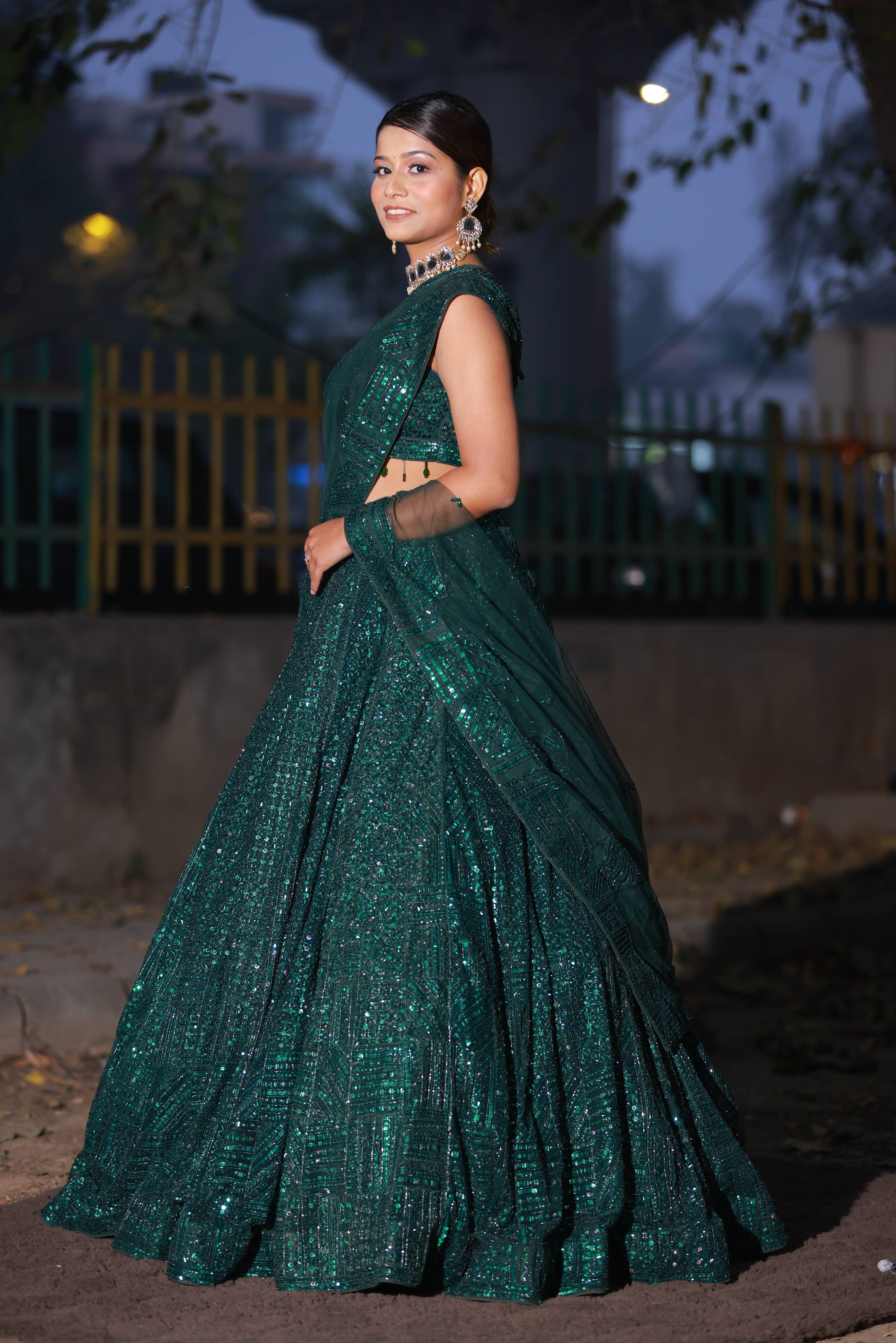 Glamorous Emerald Green Sequin Lehenga with One-Shoulder Blouse and Net Dupatta