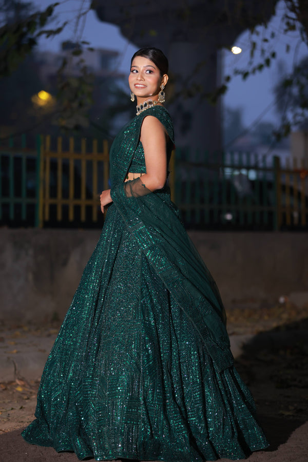 Glamorous Emerald Green Sequin Lehenga with One-Shoulder Blouse and Net Dupatta