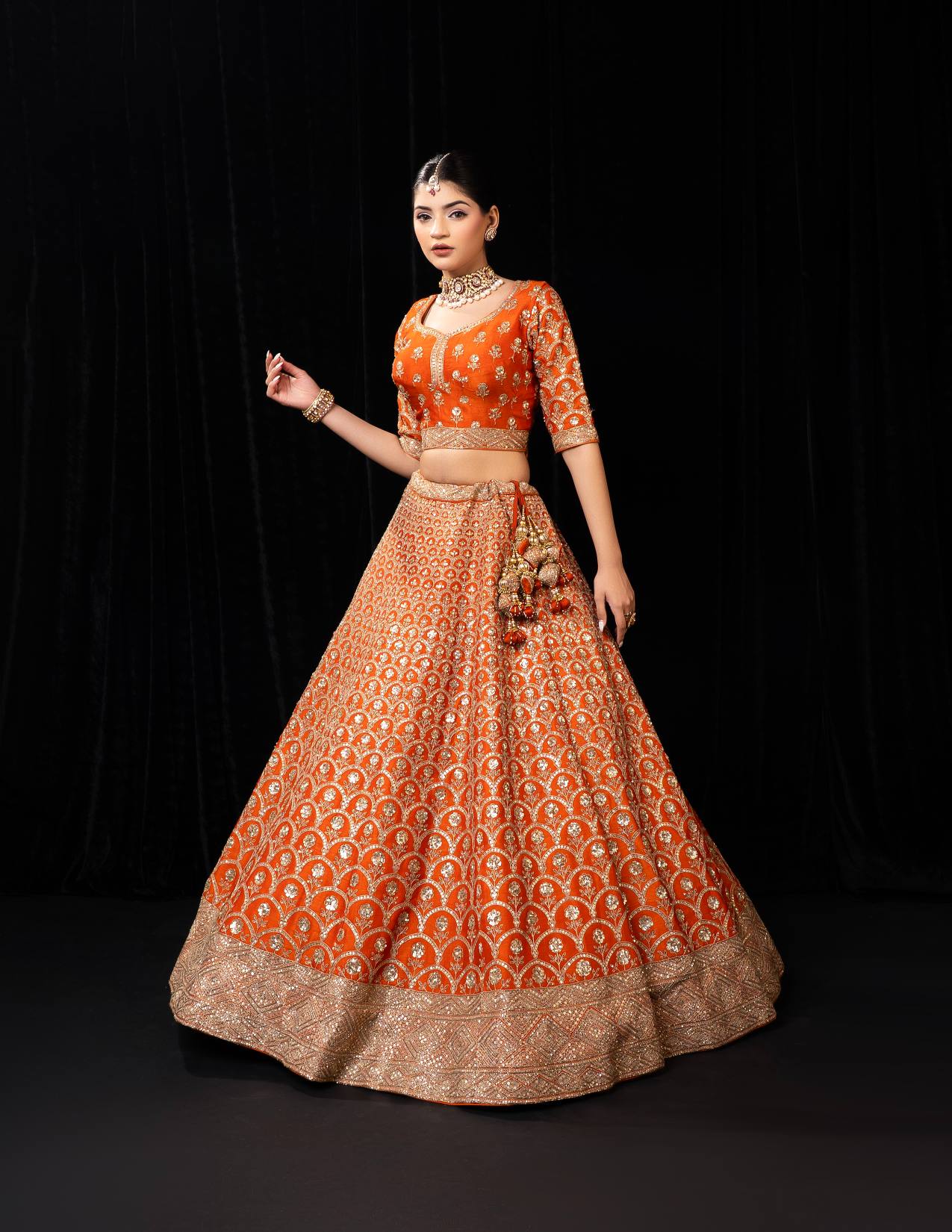 Regal Orange Bridal Lehenga with Golden Zari Embroidery and Peacock Motifs