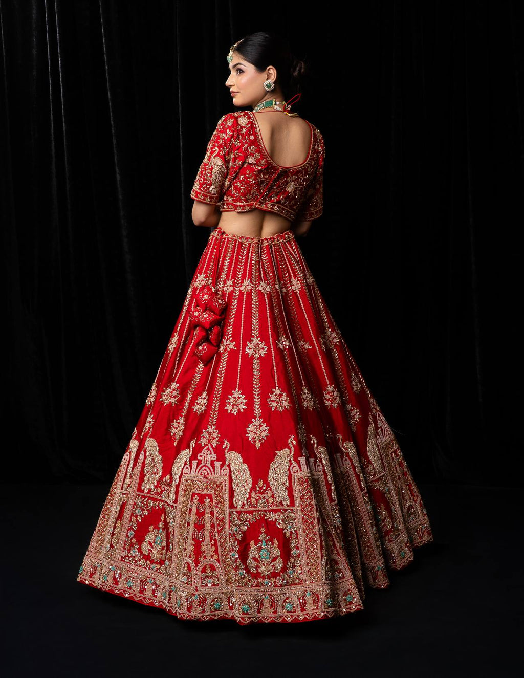 Luxurious Crimson Red Bridal Lehenga with Golden Jharokha and Peacock Embroidery