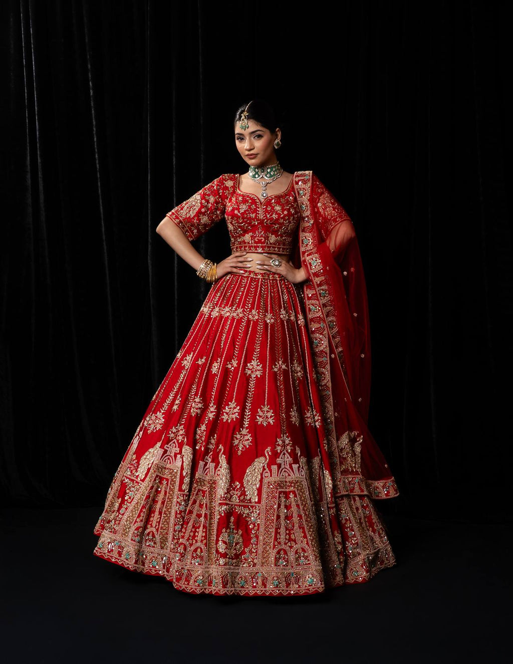 Luxurious Crimson Red Bridal Lehenga with Golden Jharokha and Peacock Embroidery
