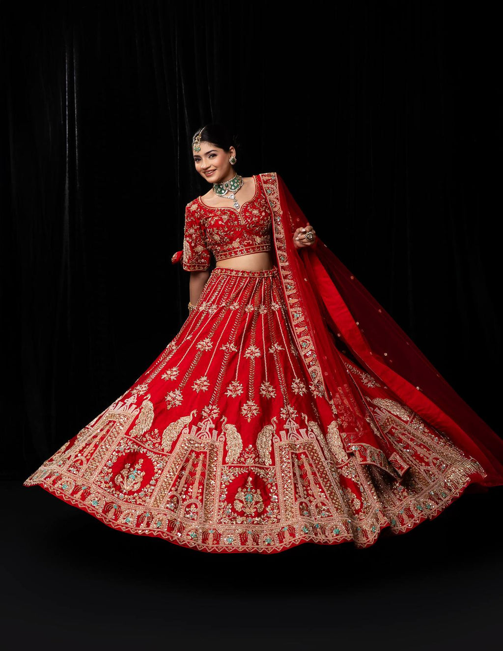 Luxurious Crimson Red Bridal Lehenga with Golden Jharokha and Peacock Embroidery