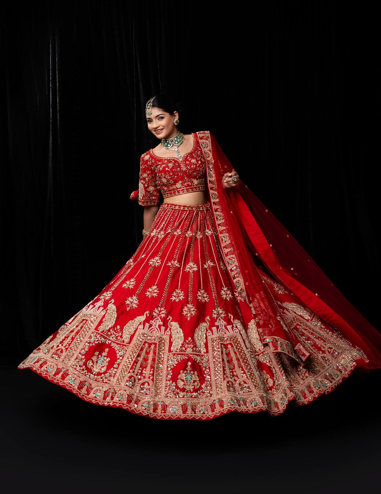 Luxurious Crimson Red Bridal Lehenga with Golden Jharokha and Peacock Embroidery