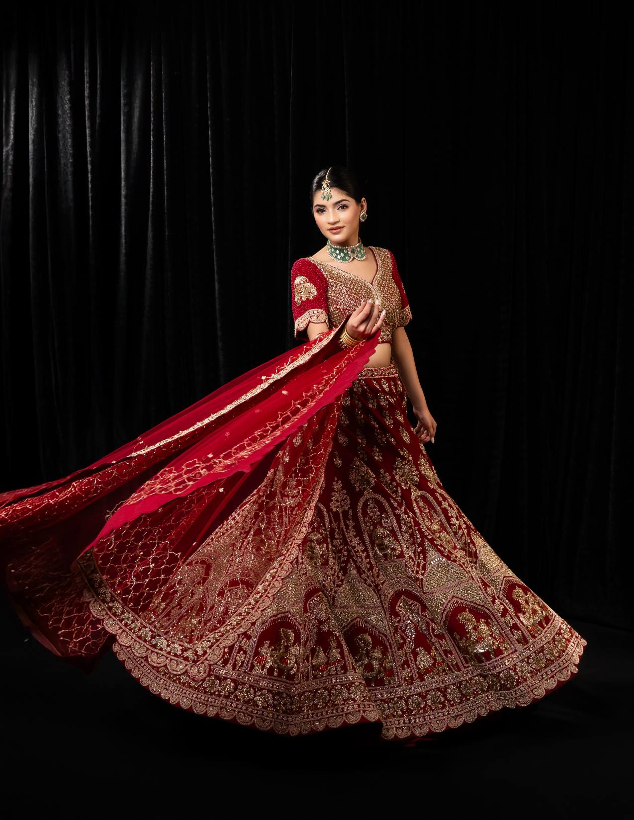 Luxurious Maroon Velvet Bridal Lehenga with Golden Jharokha Embroidery and Scalloped Border